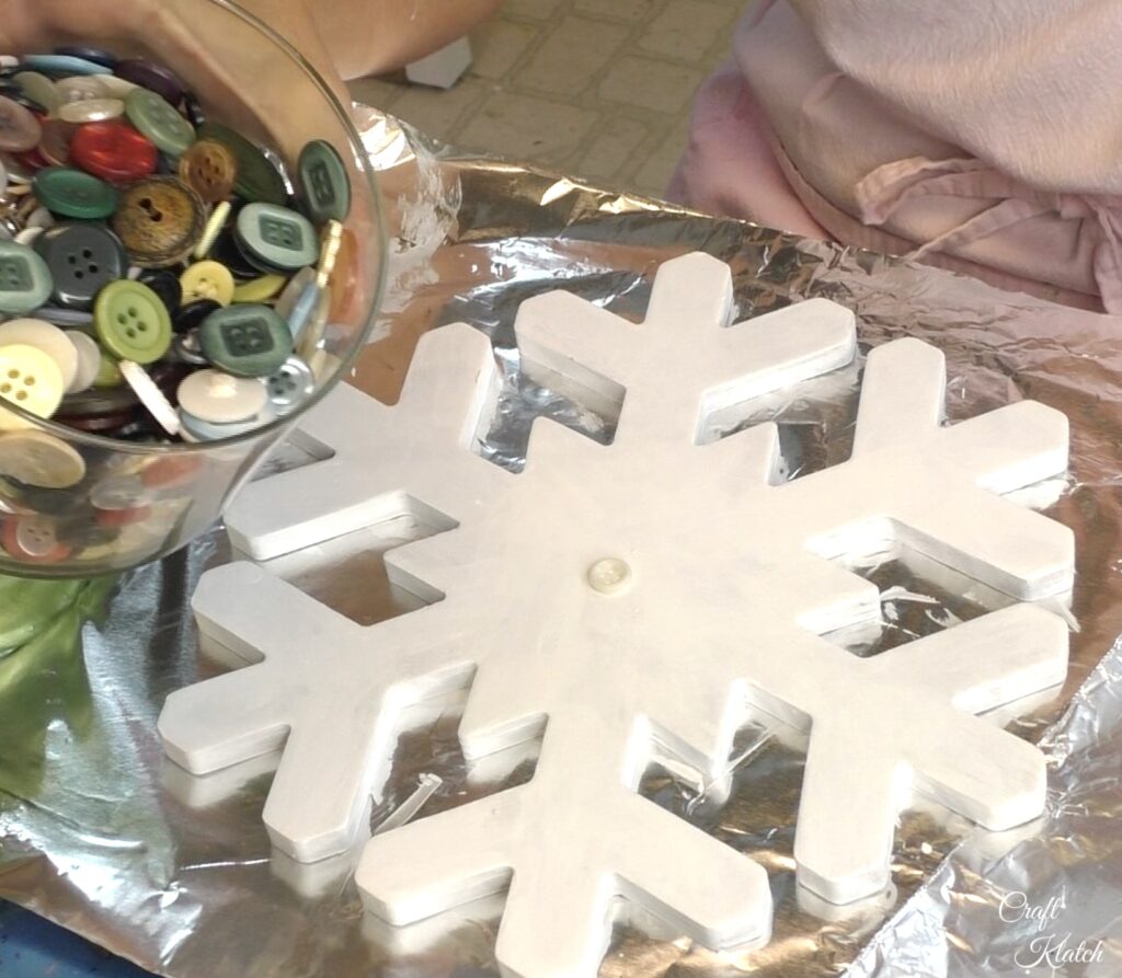 Jar of buttons and white snowflake