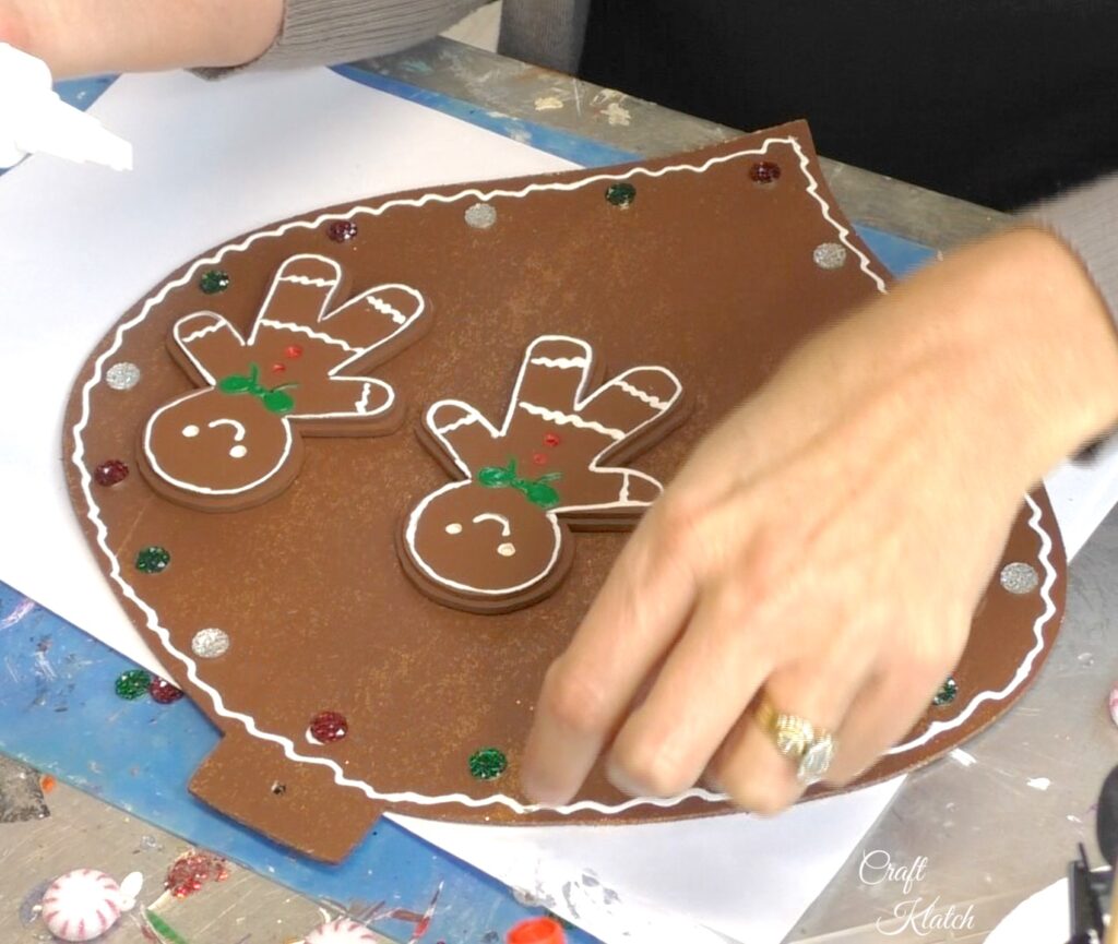 Add gems for a bit of sparkle on the gingerbread Christmas ornament copy