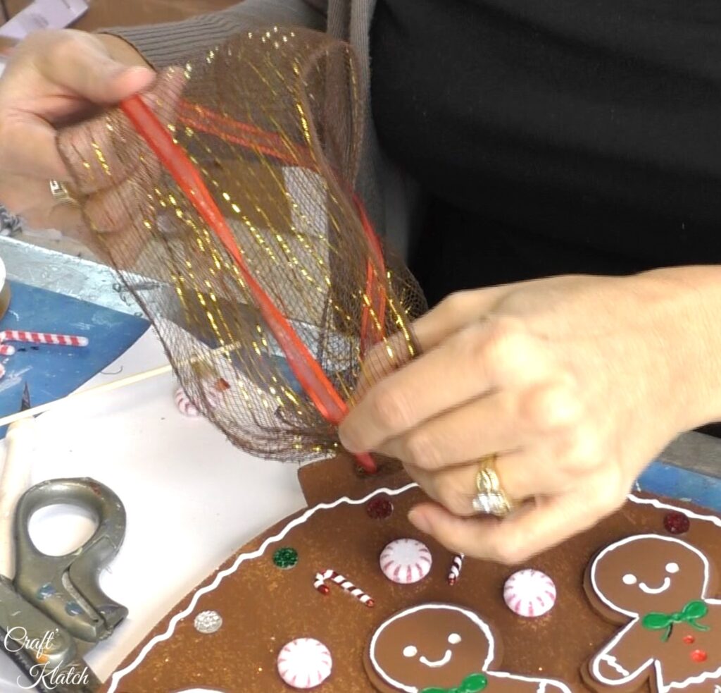 Brown and red ribbon on gingerbread Christmas ornament