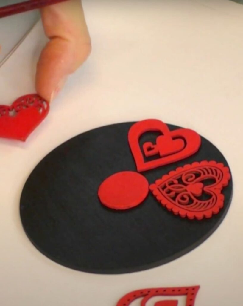 Placing the hearts on the black round for placement