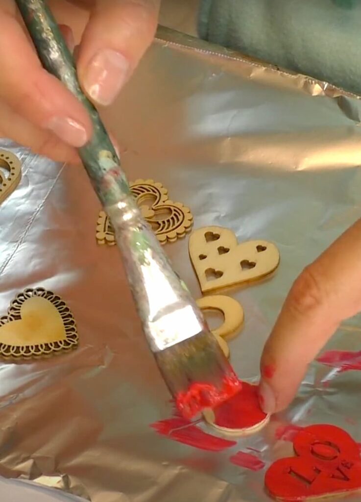 Painting wood hears red for the DIY Valentine's Day coaster