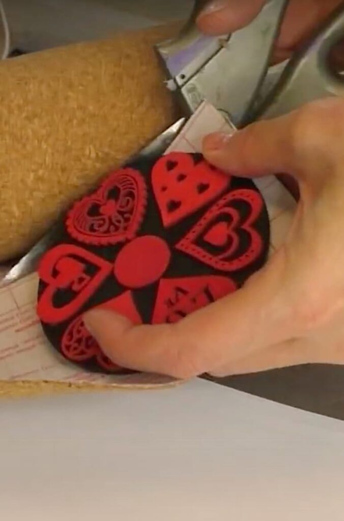 cutting cork shelf paper for the back of the DIY Valentine's Day coaster