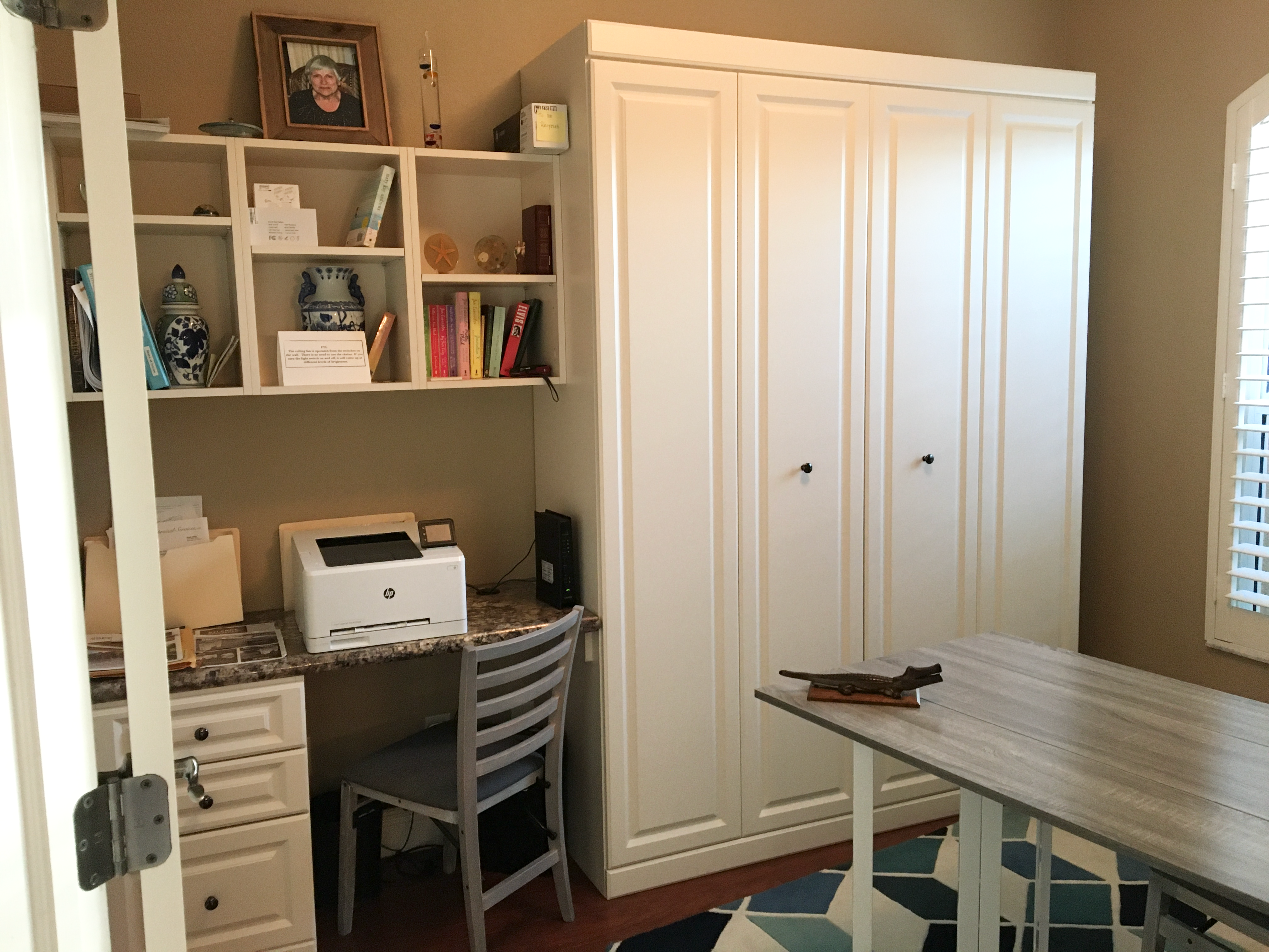 More and more people are working from home, which is creating a need for a home office. The problem arises when you have limited space and you have one room that needs to serve multiple functions. Such is the plight of the guest bedroom home office combo. Home office ideas | home office decor | home office design | guest bedroom office combo Home office with closed Murphy Bed and desk