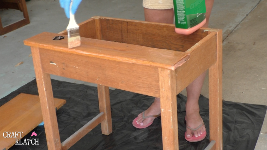 Learn how to makeover a desk using UnicornSpit and Glaze Coat! | furniture | furniture makeover | desk makeover | furniture redo | diy | home decor | Unicorn Spit | #diy #unicornspit #glazecoat #furniture #furnituremakeover #furnitureredo #homedecor #deskmakeover Brushing Citristrip stripper on an old desk