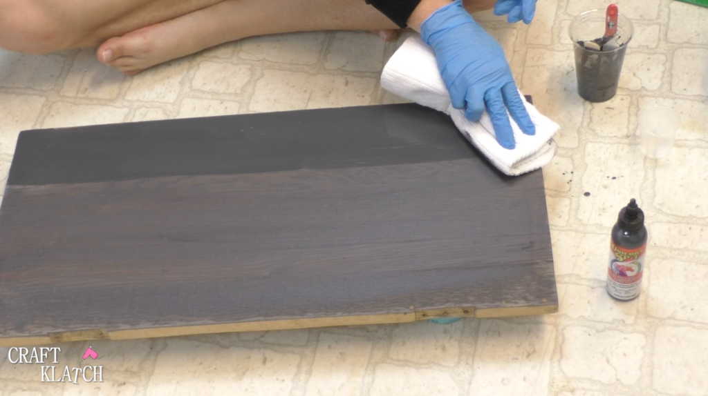 Learn how to makeover a desk using UnicornSpit and Glaze Coat! | furniture | furniture makeover | desk makeover | furniture redo | diy | home decor | Unicorn Spit | #diy #unicornspit #glazecoat #furniture #furnituremakeover #furnitureredo #homedecor #deskmakeover Using rag to wipe off excess Unicorn Spit stain, in Weathered Daydream, to stain the wood desktop