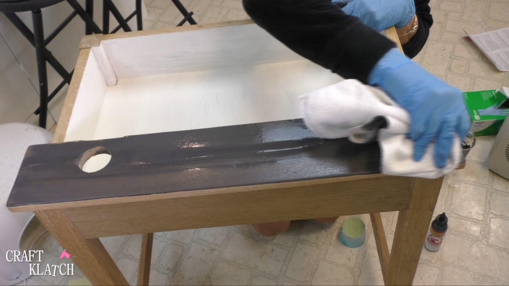Learn how to makeover a desk using UnicornSpit and Glaze Coat! | furniture | furniture makeover | desk makeover | furniture redo | diy | home decor | Unicorn Spit | #diy #unicornspit #glazecoat #furniture #furnituremakeover #furnitureredo #homedecor #deskmakeover Using rag to wipe off excess Unicorn Spit stain, in Weathered Daydream, to stain the wood desktop