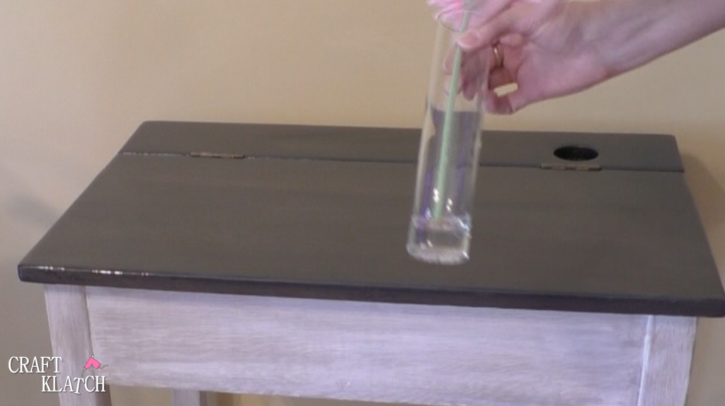 Learn how to makeover a desk using UnicornSpit and Glaze Coat! | furniture | furniture makeover | desk makeover | furniture redo | diy | home decor | Unicorn Spit | #diy #unicornspit #glazecoat #furniture #furnituremakeover #furnitureredo #homedecor #deskmakeover Small bud vase, with pink Gerbera daisy to be put into desk inkwell after makeover