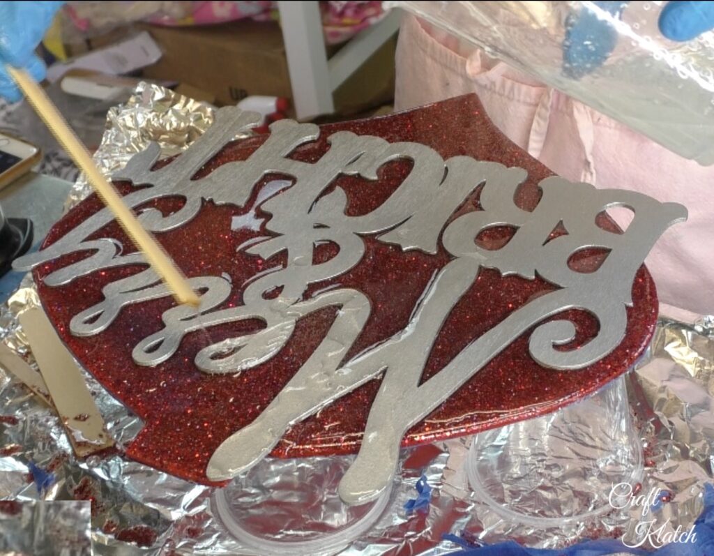 Dollar Tree Ornament Makeover #2 and this time we added glitz and glam to the Christmas decoration tutorial! A little resin and glitter make holiday art! Fun Christmas craft ideas! #craftklatch #craftideas #chiristmas #christmascrafts #resin #resinart #dollartree #dollartreecrafts #dollartreediys