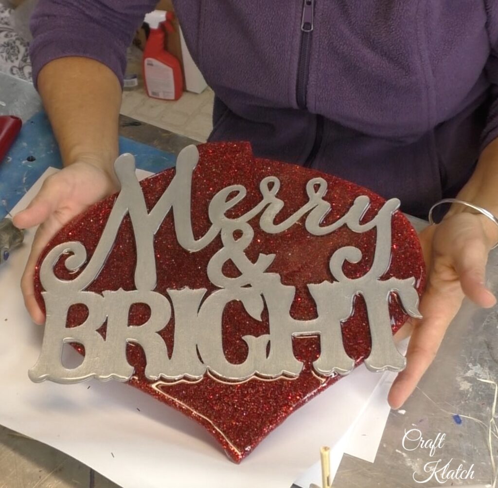 Dollar Tree Ornament Makeover #2 and this time we added glitz and glam to the Christmas decoration tutorial! A little resin and glitter make holiday art! Fun Christmas craft ideas! #craftklatch #craftideas #chiristmas #christmascrafts #resin #resinart #dollartree #dollartreecrafts #dollartreediys