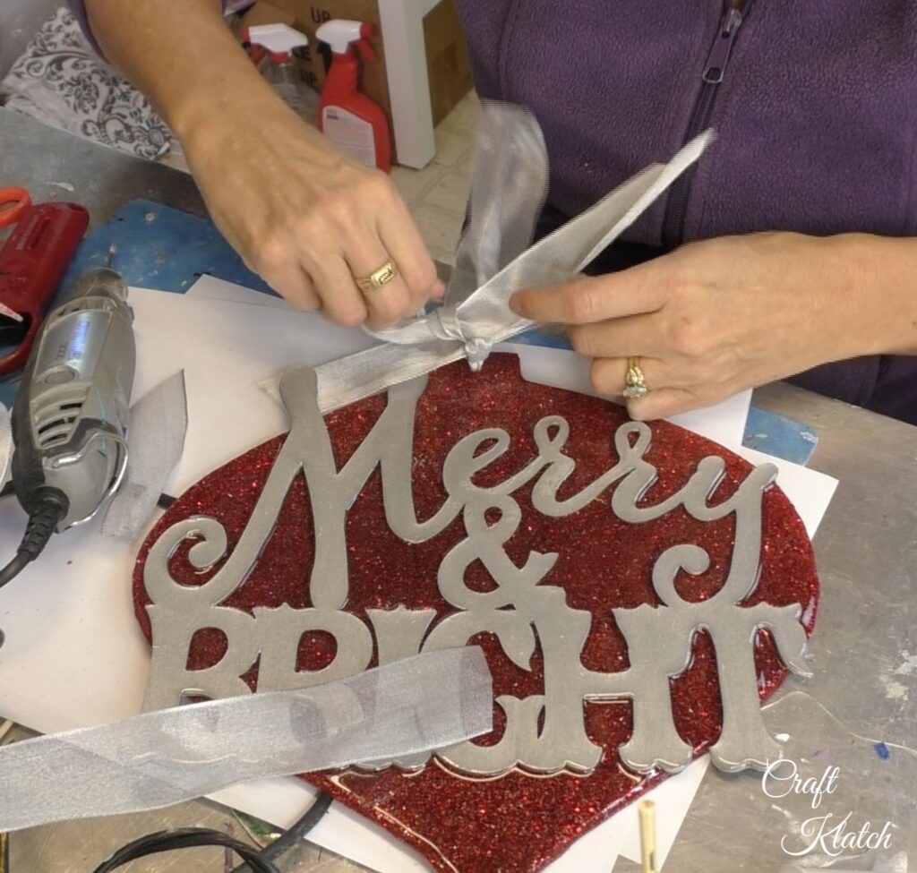 Dollar Tree Ornament Makeover #2 and this time we added glitz and glam to the Christmas decoration tutorial! A little resin and glitter make holiday art! Fun Christmas craft ideas! #craftklatch #craftideas #chiristmas #christmascrafts #resin #resinart #dollartree #dollartreecrafts #dollartreediys