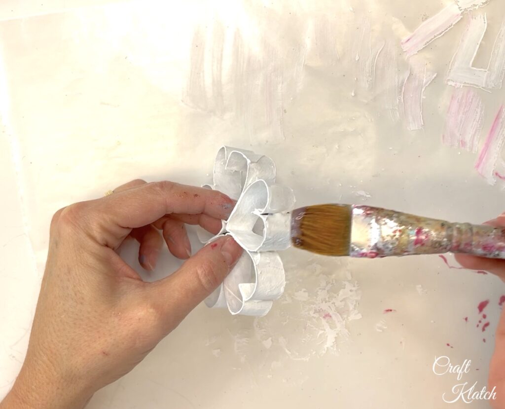 Brush paper snowflake with clear glue