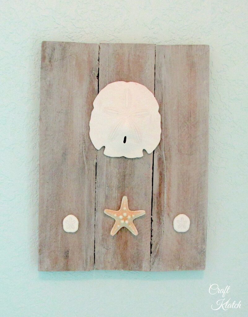 Pallet wall hanging with shells and sand dollar