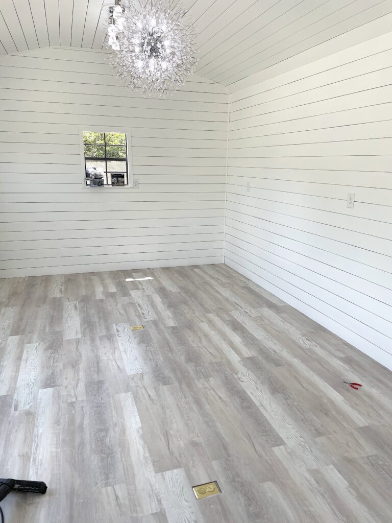 Craft room she shed building with the flooring, shiplap and siding