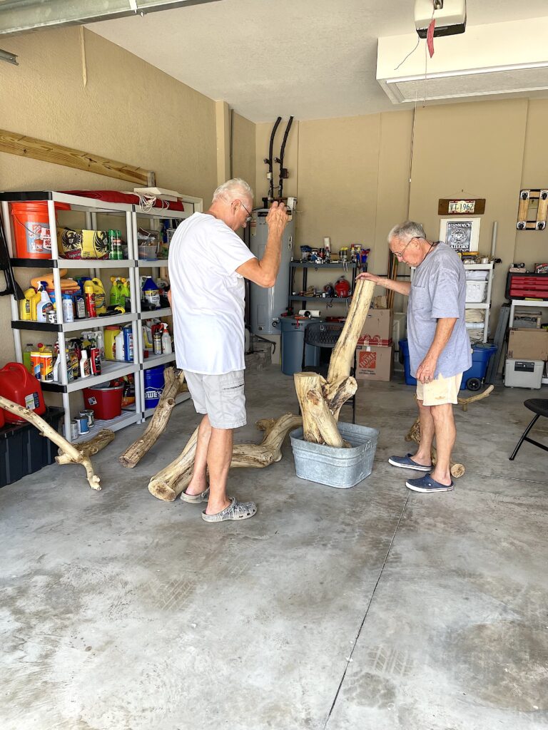 Dad & Greg arguing about base of cat tree DIY