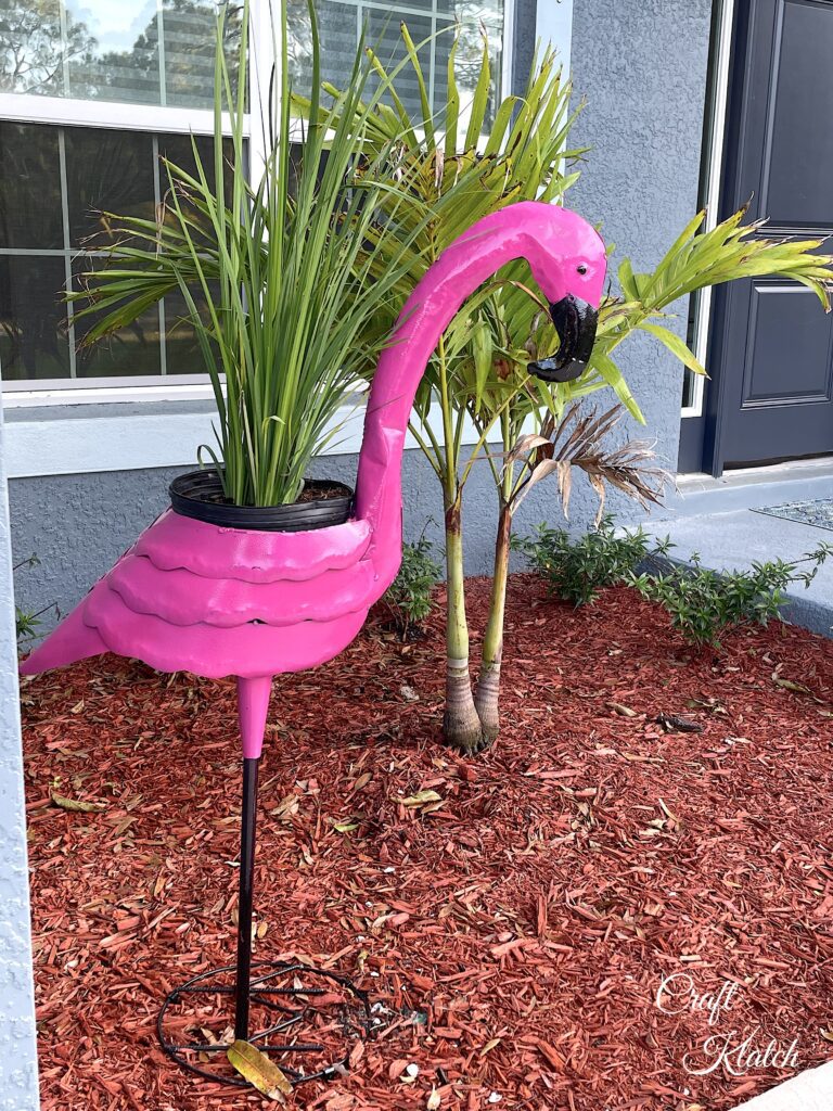Flamingo planter in front yard