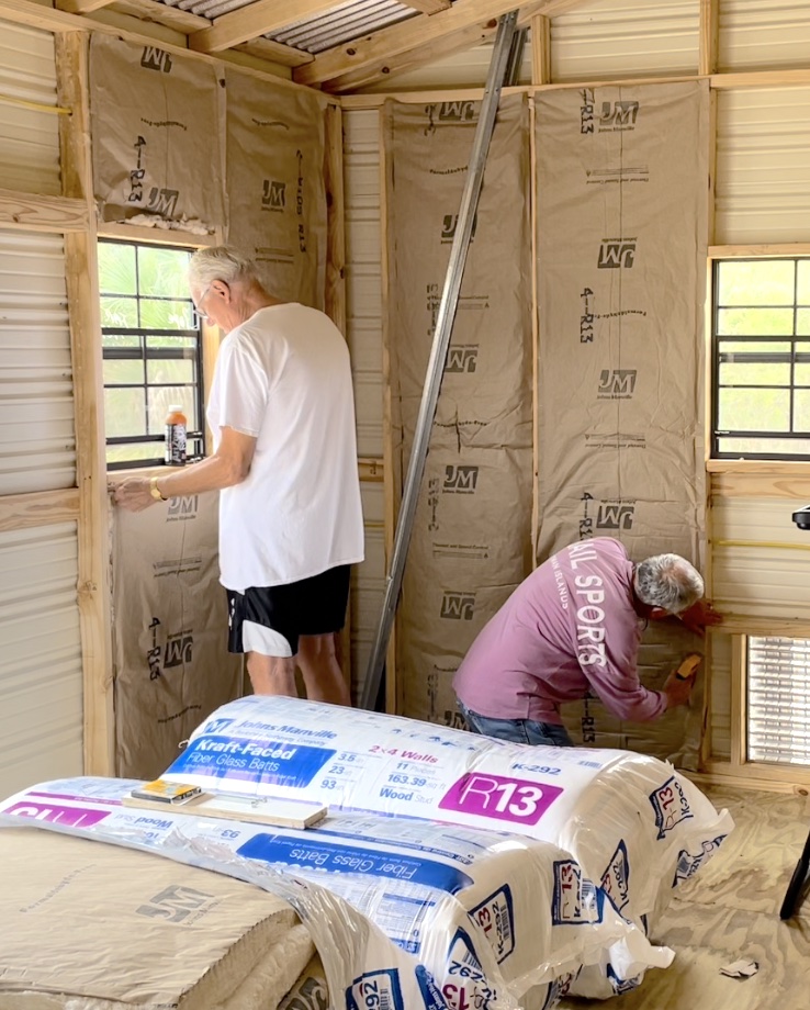 Greg and Dad insulating the she shed building
