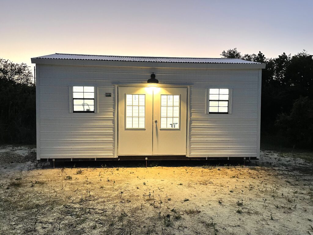 Shed building lit up at night