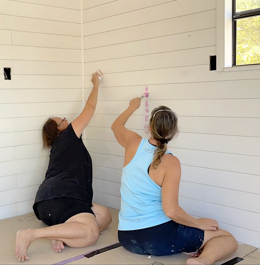 Tina and Mona spackling shiplap siding