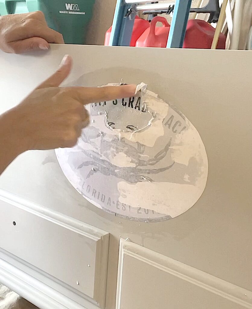 Rubbing excess paper off the back of the image transfer