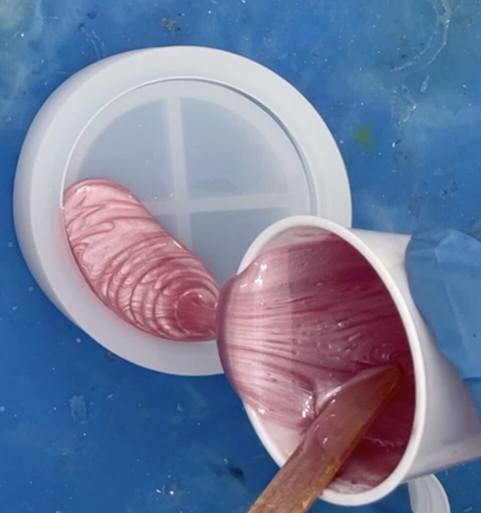 pour pink resin into the lid of the tooth fairy jar idea mold