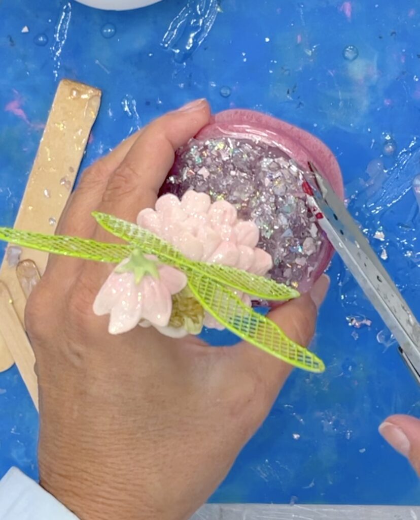 Trim off sharp edges of resin from tooth fairy jar idea