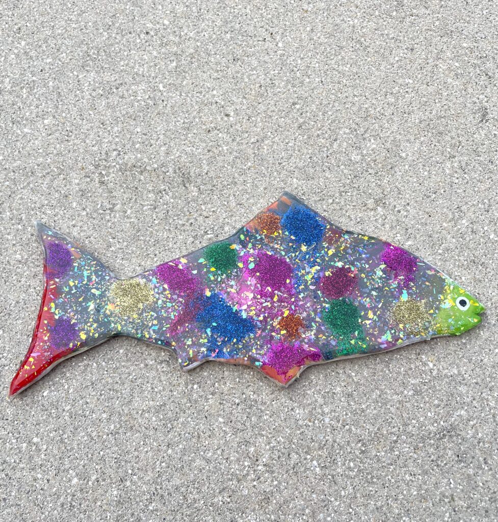 Family tradition fish with glitter and colorful spots