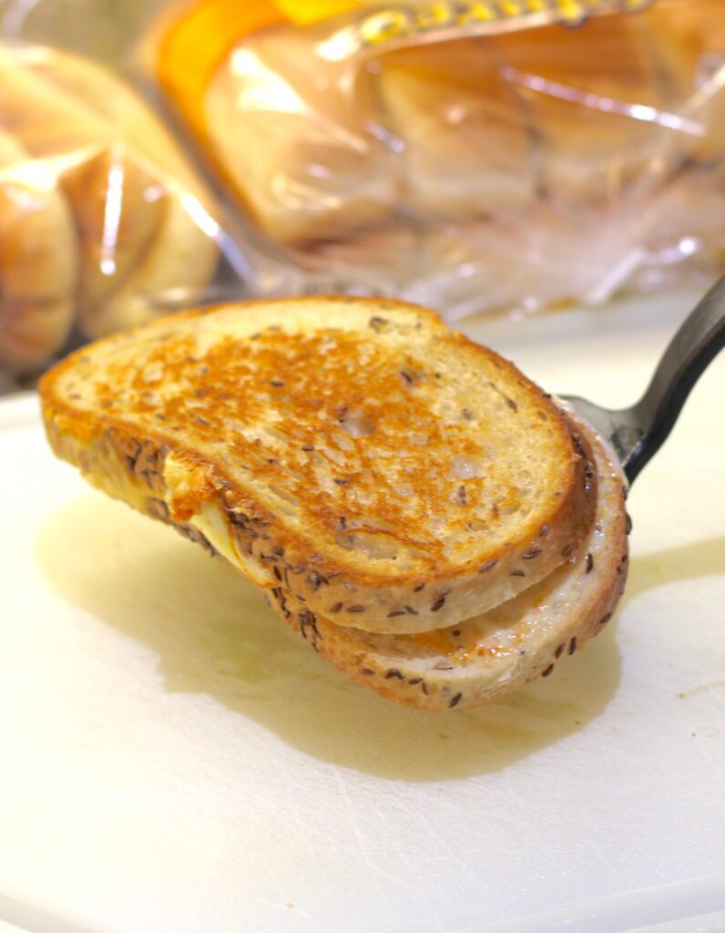Remove grilled cheese sandwiches from pan. It's the perfect cheese sandwich grilled.