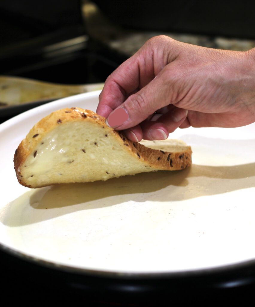 Place bread into the pan butter side down