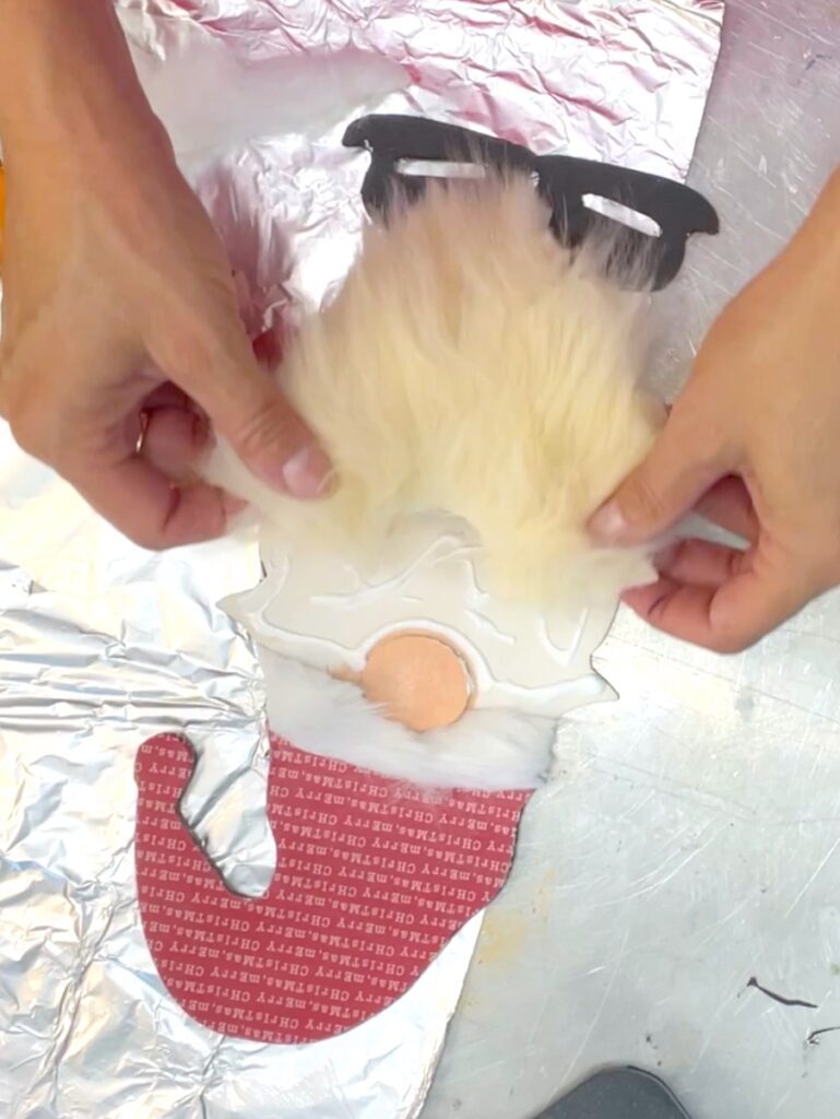 Glue beard on the Christmas gnome ornament