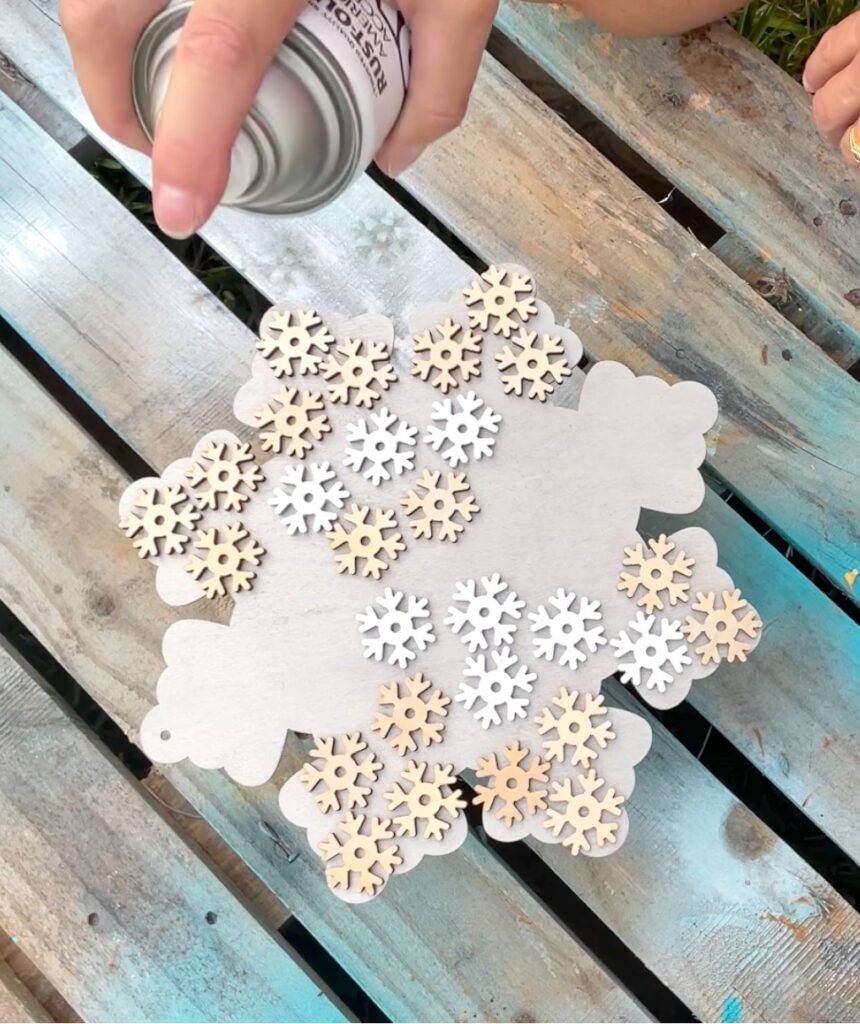 paint large snowflake ornament with little wood snowflakes