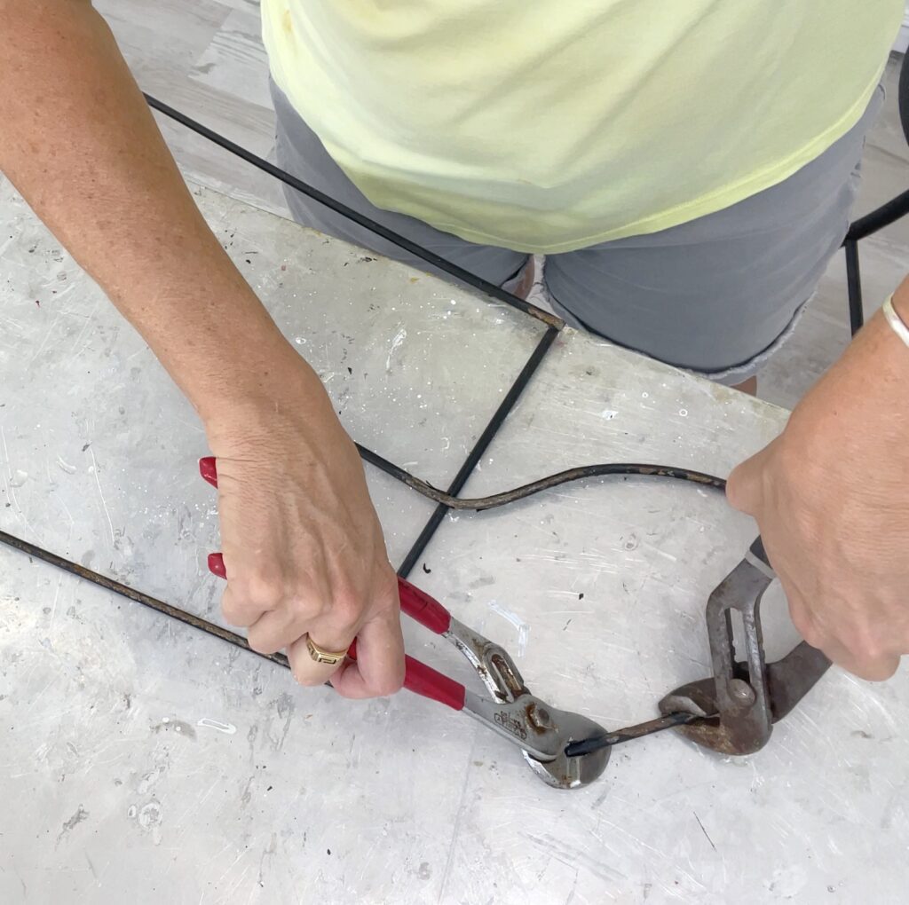 Bending the trellis to create the oversized Christmas ornament cap