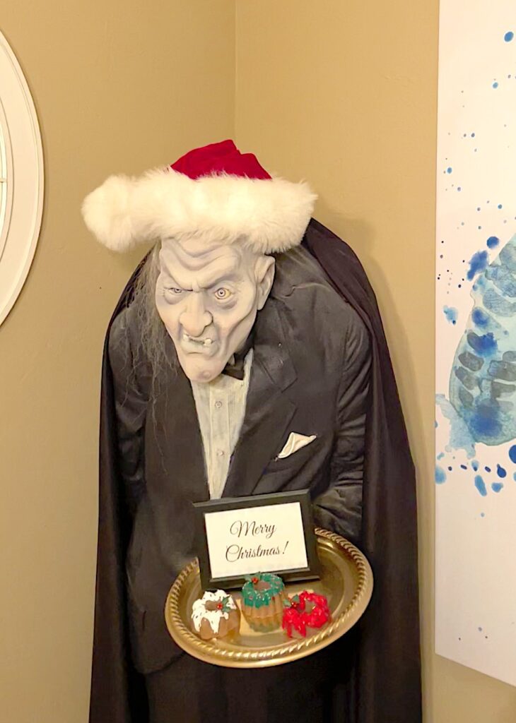 Butler in dining room decorated for Christmas