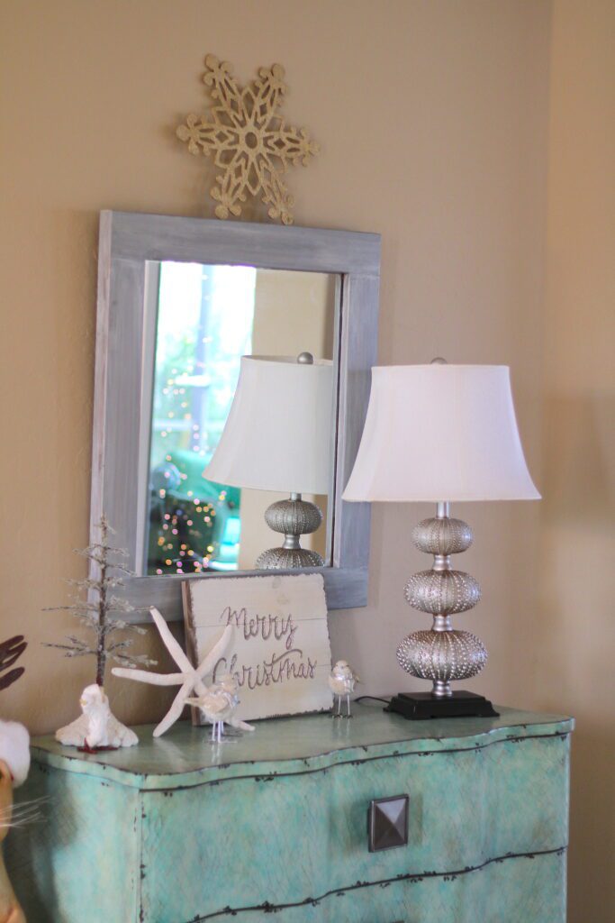 Foyer Christmas decorations with snowflake over mirror