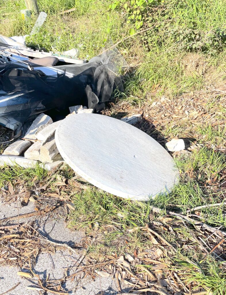 Outdoor Christmas Decorations DIY Before picture of the dirty damaged tabletop on the side of the road