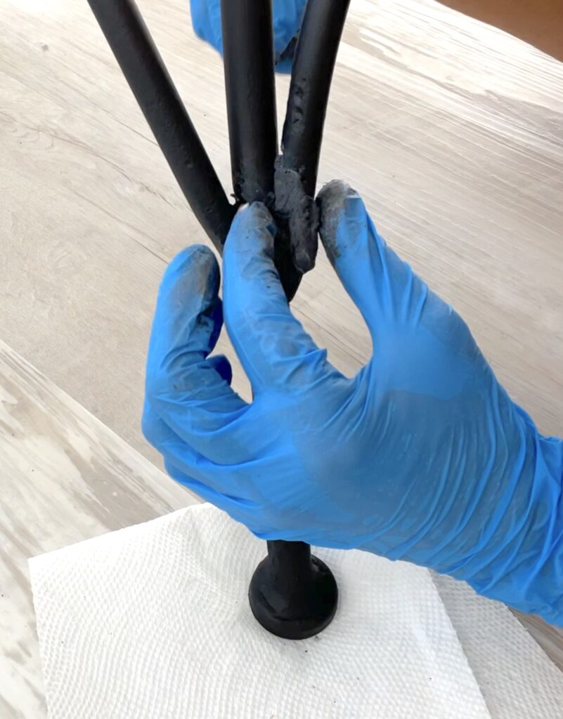 Add JB Weld SteelStik to fill in the rust holes in the metal chair