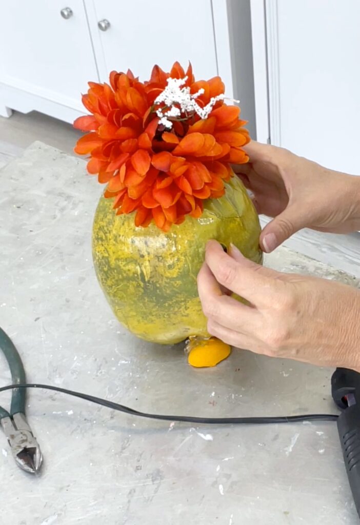 gluing eyeballs onto cocnut chick easter craft