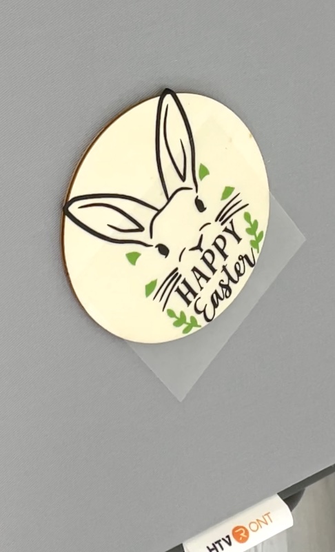 Wood Easter bunny coaster with heat transfer vinyl Easter bunny and green leaves