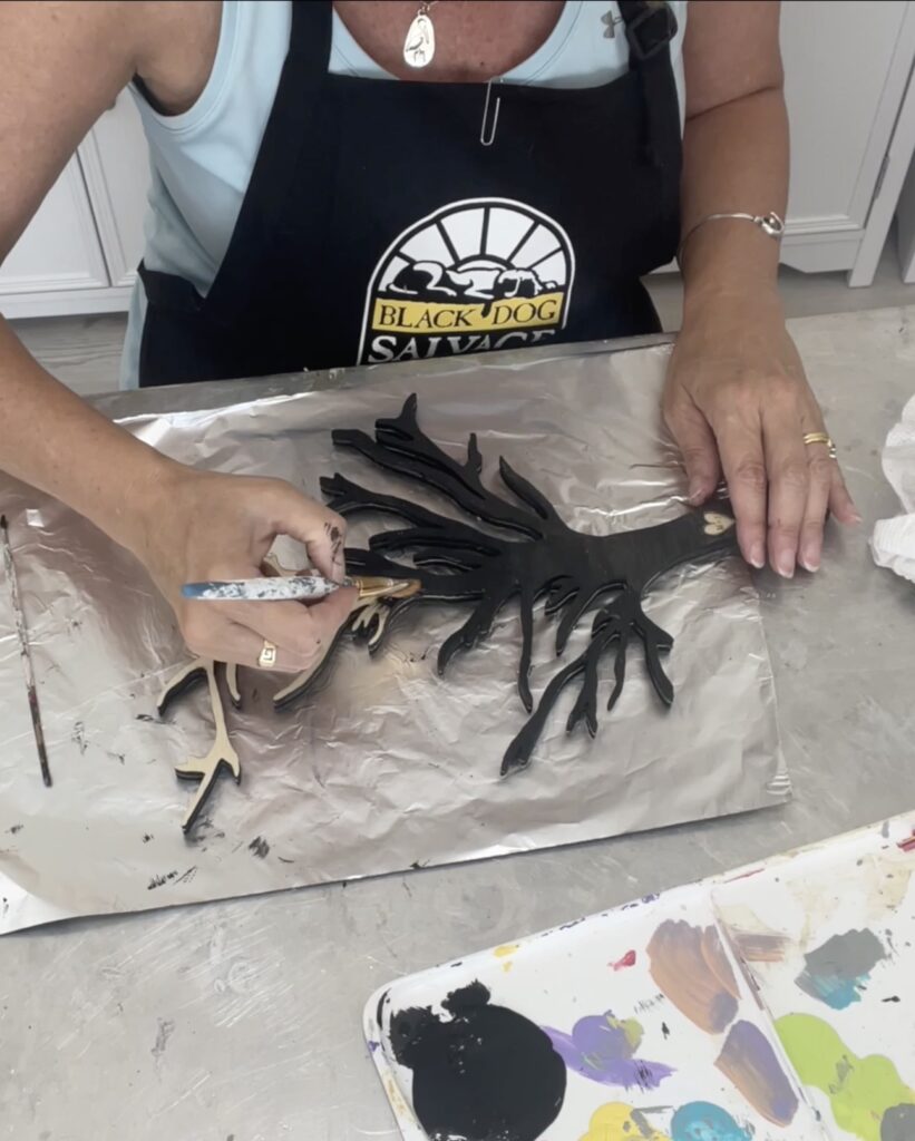 Painting the wedding tree black to look like a silhouette copy for the wedding guest book alternative