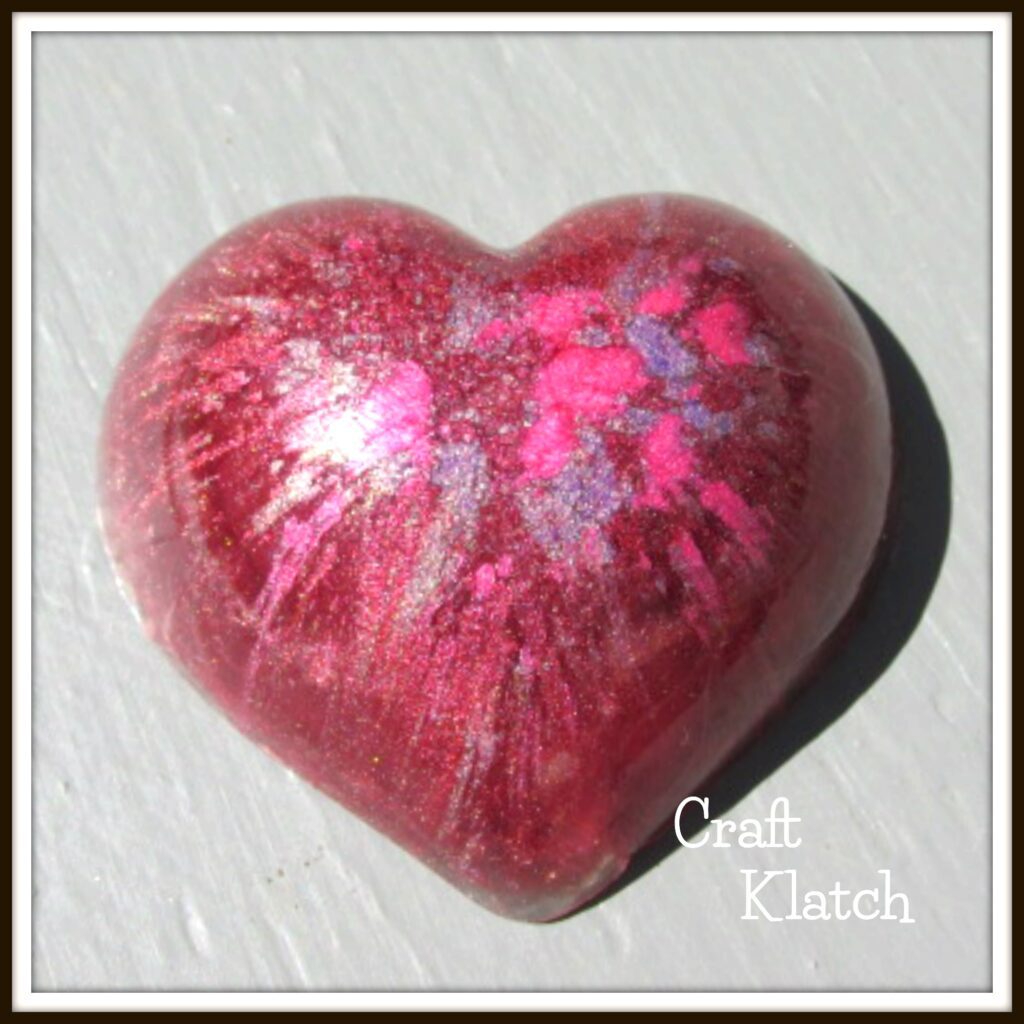 Resin pigment heart made with a plastic mold