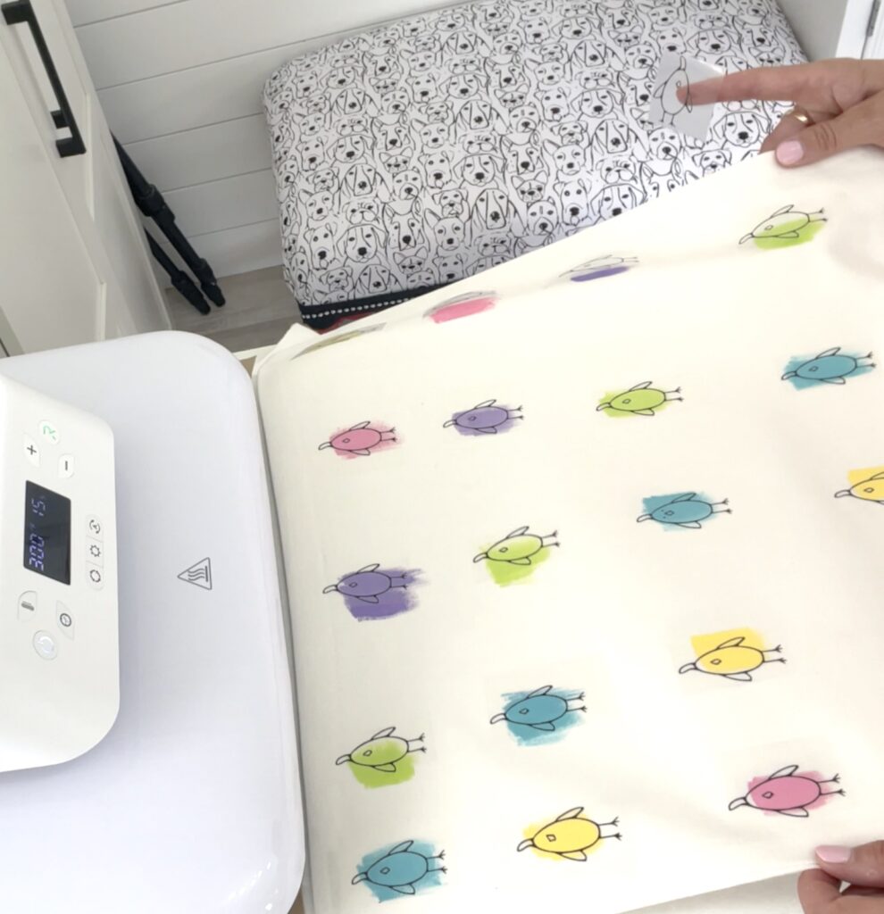 Putting the easy easter pillow cover in the automatic heat press