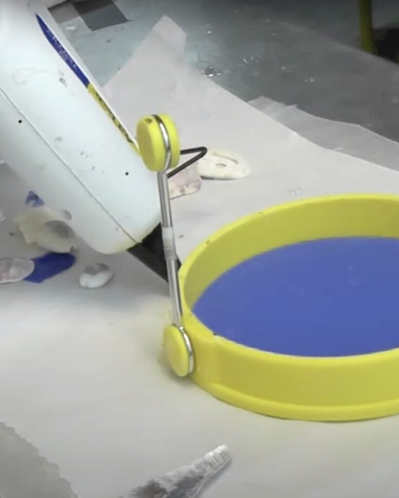 Yellow silicone egg shaper to make a resin mold for a coaster