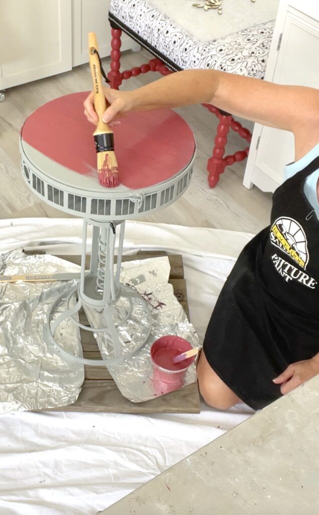 painting the wine and paint corkscrew table top with Black Dog Salvage furniture paint in pickled beets