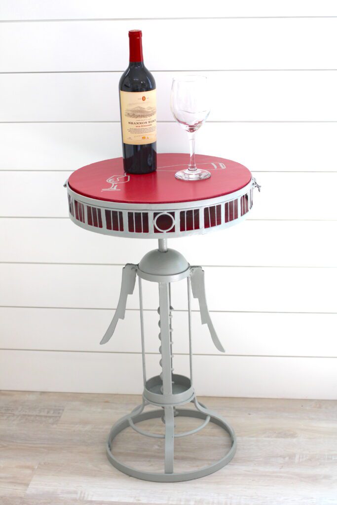 wine and paint corkscrew table makeover with wine and wine glass on table
