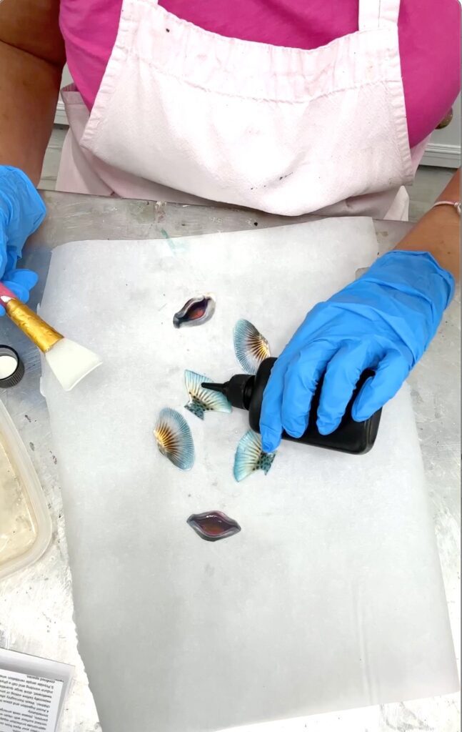 Putting UV resin on the pufferfish fins