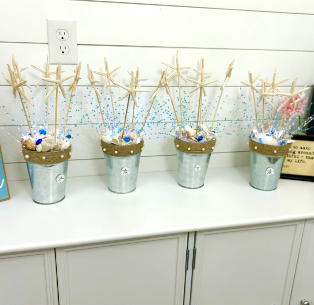 Four finished beach wedding shower centerpieces