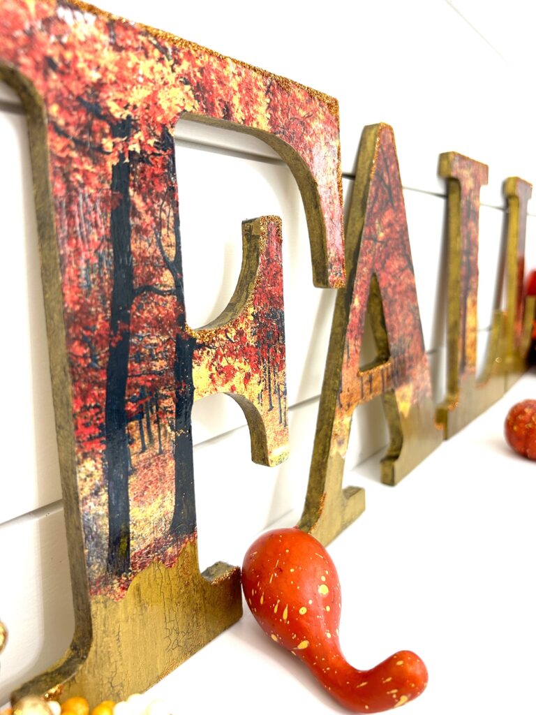 Decoupaged fall wood letters close up