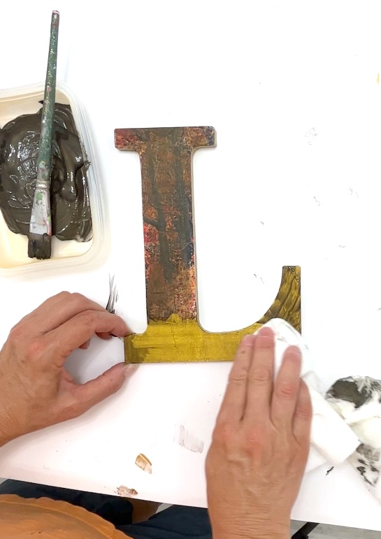 Wiping off black/bronze metallic paint from wood letters