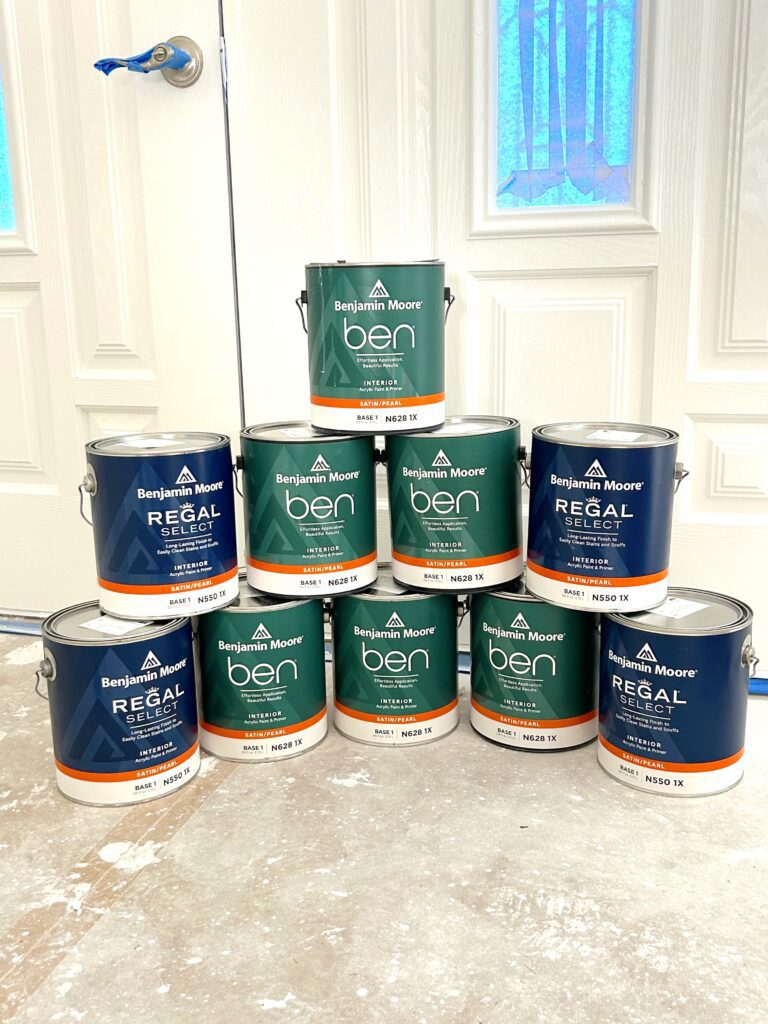 Benjamin Moore Satin Pearl paint cans stacked
