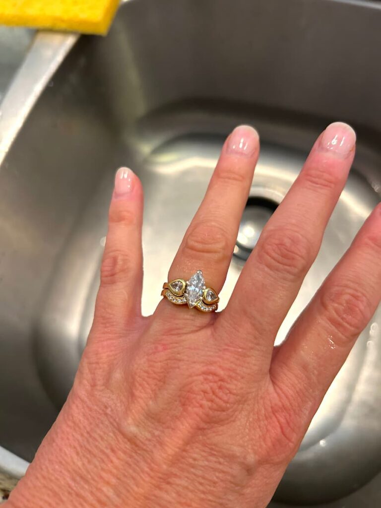 hand with diamond wedding ring