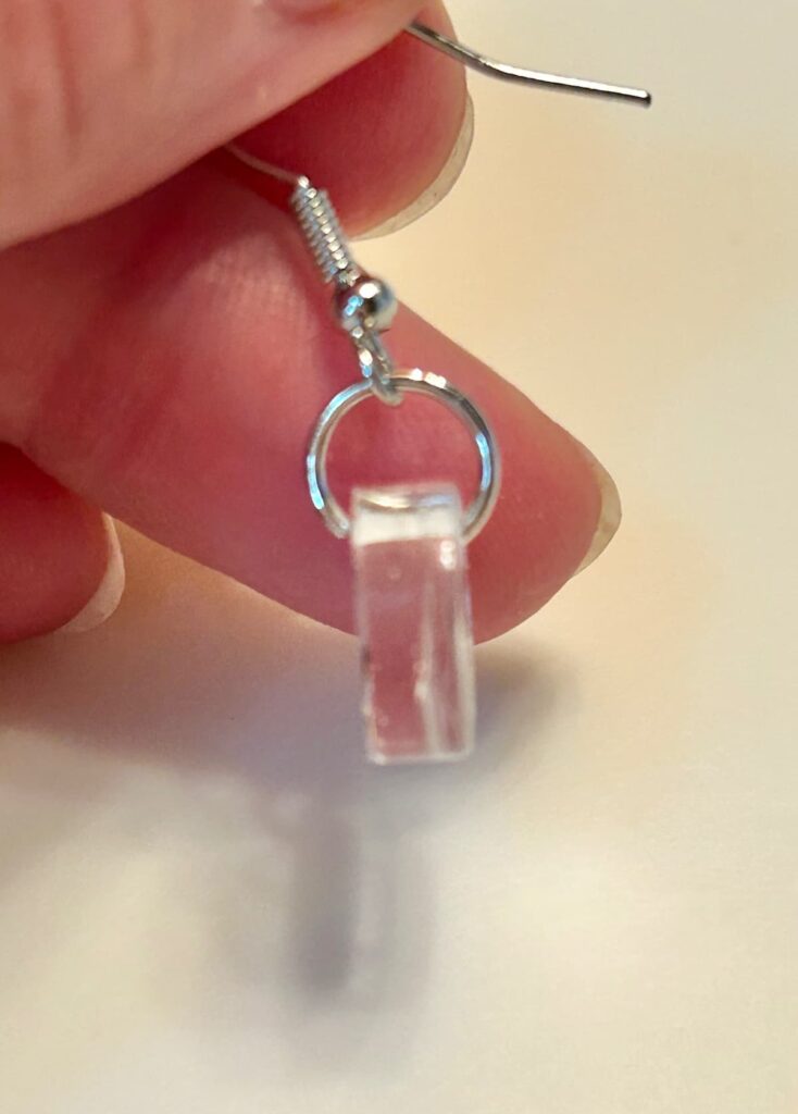 Add jump ring and earring finding to nail art sticker charms